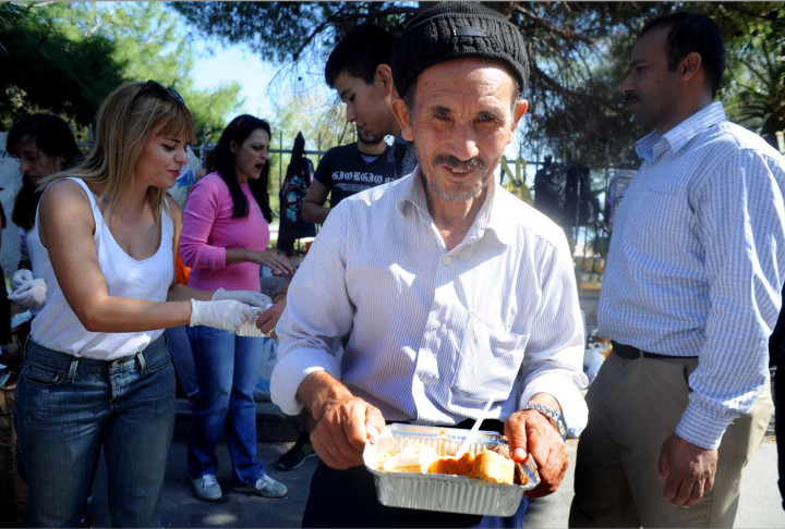 October 4,2015-Lesvos, North-east Aegean sea, Greece: Refugees arrive by a small plastic and cheap boat to the coasts of the Greek island Lesvos from the Turkish land (Maro Kouri)