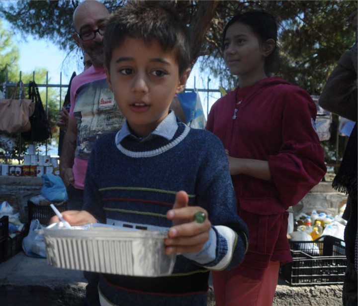 October 4,2015-Lesvos, North-east Aegean sea, Greece: Refugees arrive by a small plastic and cheap boat to the coasts of the Greek island Lesvos from the Turkish land (Maro Kouri)