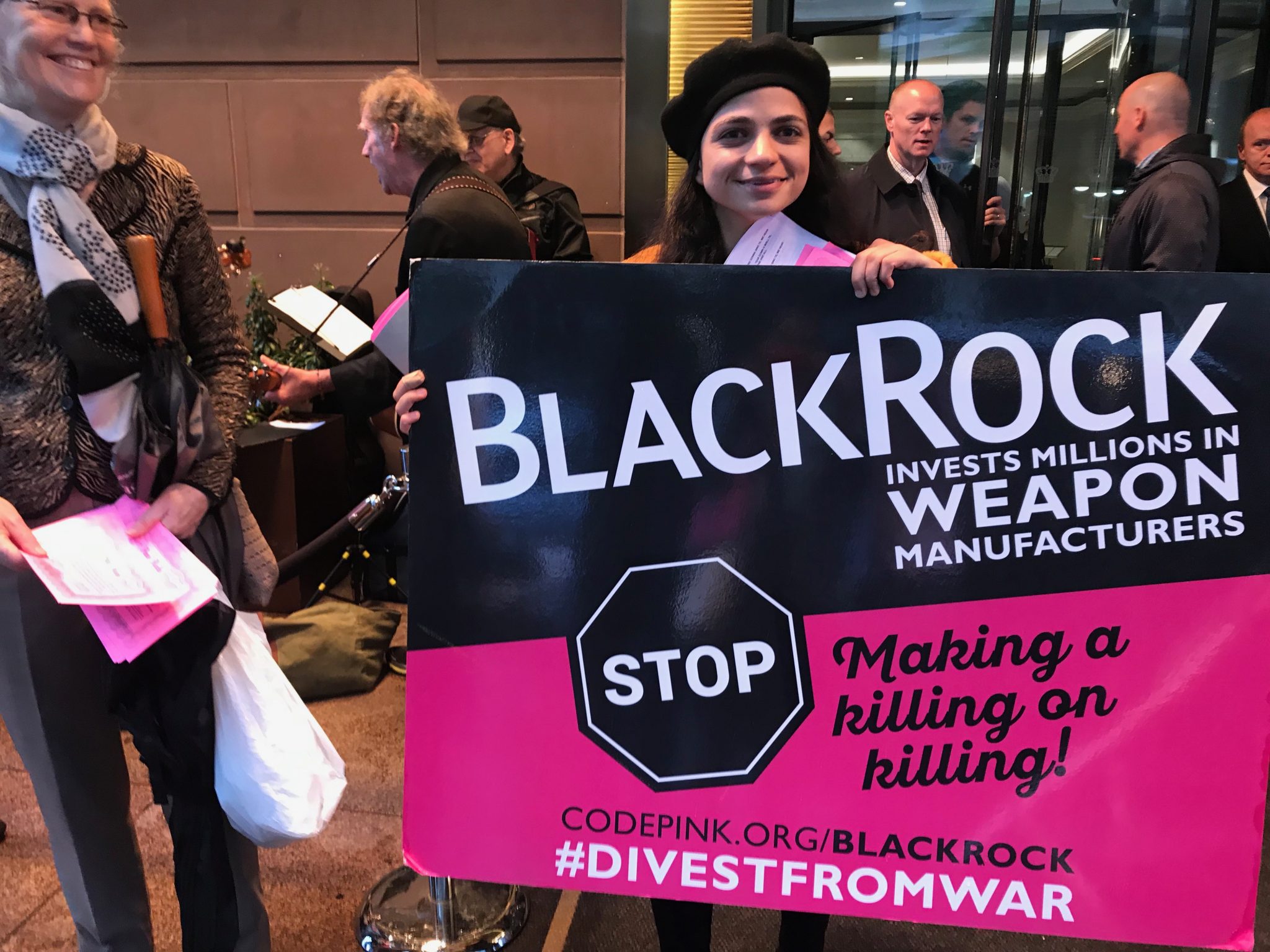 A protester holding a placard saying U.S. war machine: real threat to  peace at a rally against war with Russia sponsored by multiple groups  including CODEPINK: Women for Peace, Black Alliance for