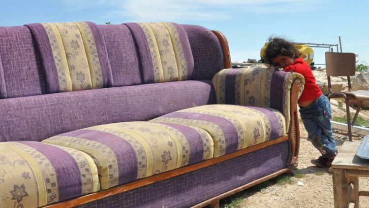 The three-year-old girl in the photograph had been twice displaced with her family in the West Bank over the past year. (2018)