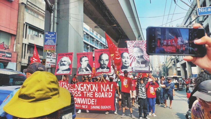 Protesters proudly held up posters of esteemed historical figures who made significant contributions to the realization of worker's rights.