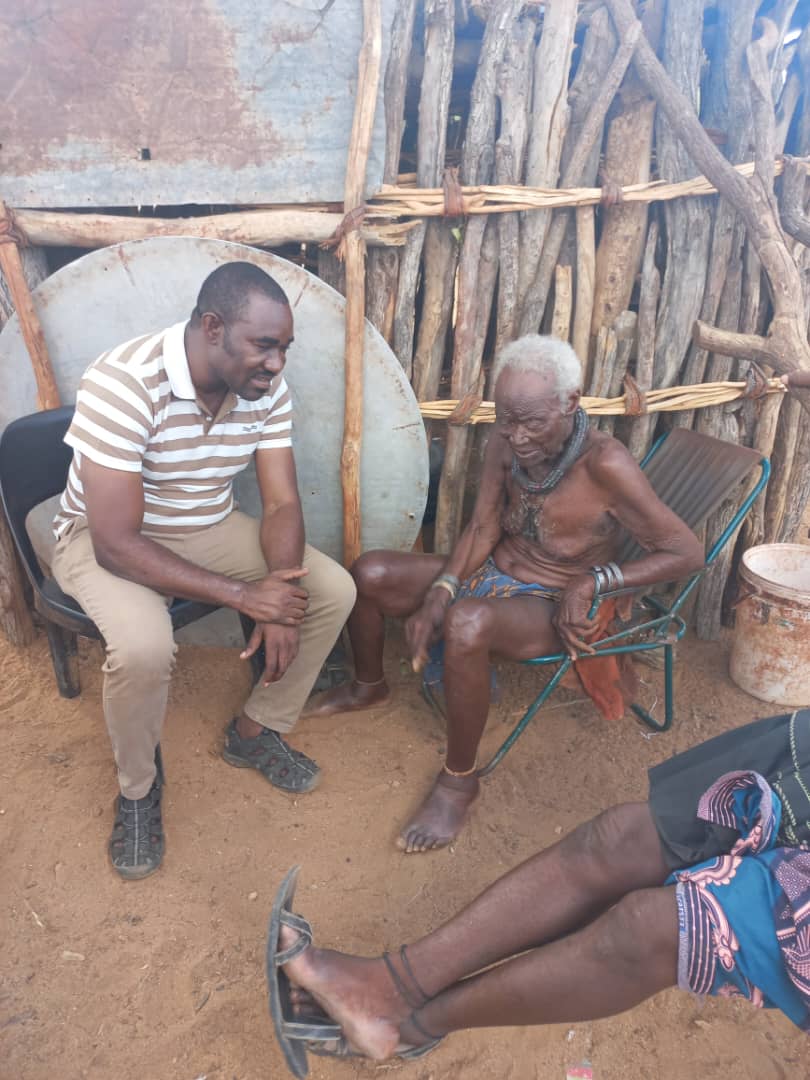 Tjikunda Katjina Kulunga, a founding member of the Namibia Indigenous People’s Advocacy Platform, in conversation with a Himba elder