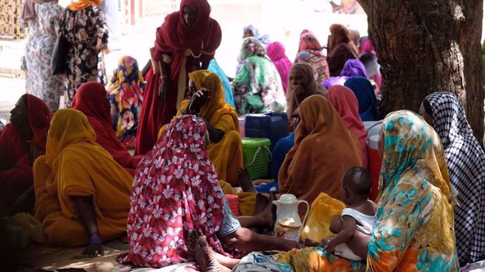 Women, pregnant or with young children, wait for appointments at a maternity hospital in Port Sudan.
