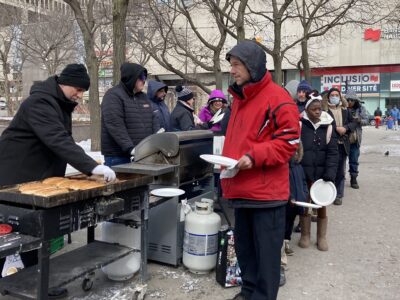 Photo credit: Anne Farrell, food distribution to family downtown Montreal, Sunday March 19