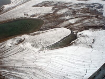 The image was taken in High Arctic from a helicopter. It shows the crack pattern in permafrost. Author: Brocken Inaglory. Wikimedia Commons.