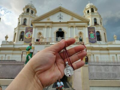 The medallion with the Minor Basilica and National Shrine of Jesus Nazareno in the foreground.