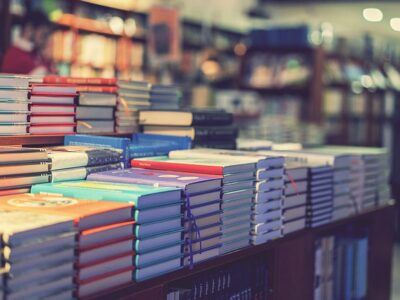 Lot Of New Books In Hardcover. Image Of Abstract Blur People At