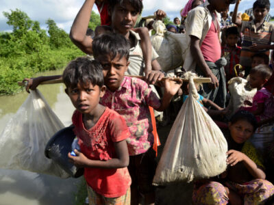 Hundreds of Rohingya people crossing Bangladesh's border as they flee from Buchidong at Myanmar after crossing the Nuf River in Taknuf.