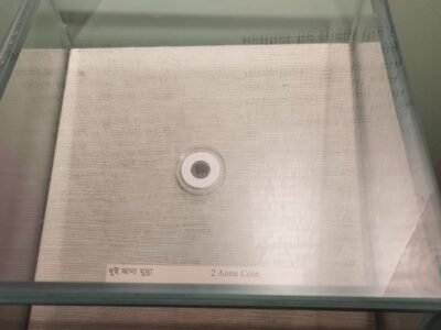 A silver 'Pakistani two anna' coin gleams in a glass showcase in the corner of Gallery-4 of the Liberation War Museum. Photo: Courtesy of the Liberation War Museum.