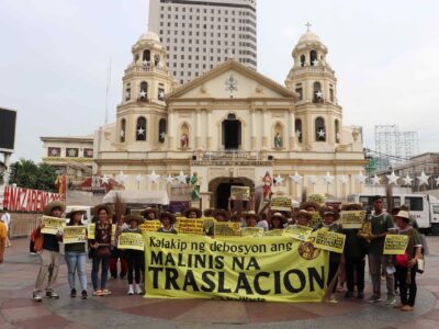 TRASH-LESS TRASLACION:  Members of the waste and pollution watchdog group EcoWaste Coalition assemble in front of Quiapo Church to exhort the devotees of the Black Nazarene to prevent and reduce trash during the reenactment of the Traslacion, and avoid leaving a trail of garbage behind.