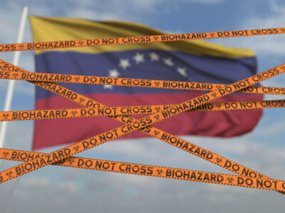 Biohazard restriction tape lines against the flag.