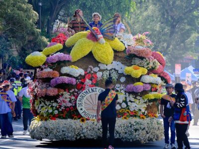 BAGUIO IN FULL BLOOM. Massive, hand-crafted floats, smothered in thousands of fresh blooms, glide through the winding streets of Baguio City during the height of the Panagbenga Festival. Photo from Inquirer.Net.