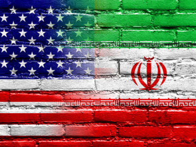 Iran and USA Flag painted on brick wall